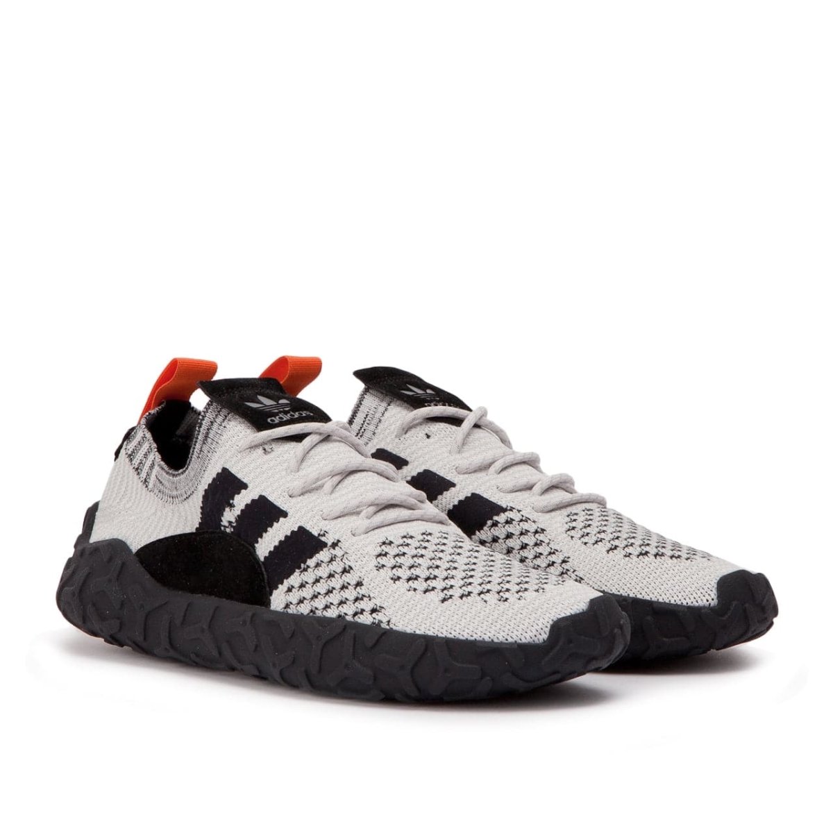 Adidas originals f/22 primeknit trainers trace orange/core black/core black best sale