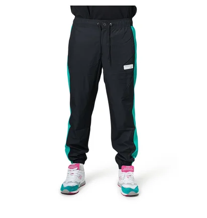 New Balance MP91507 VDE NB Athletics Windbreaker Pant (Schwarz / Türkis)