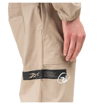 Reebok x Ghostbusters Woven Jumpsuit (Beige / Schwarz)