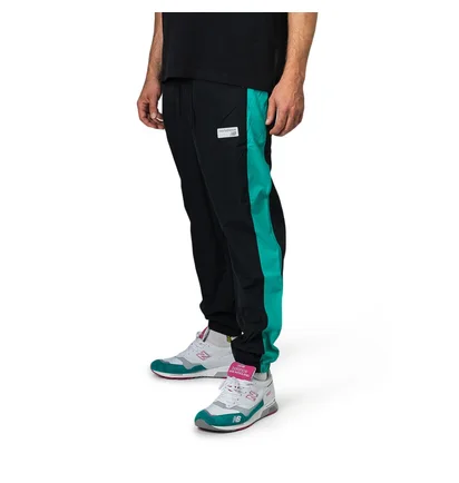 New Balance MP91507 VDE NB Athletics Windbreaker Pant (Schwarz / Türkis)