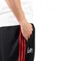 adidas x KORN Reversible Track Pants (Schwarz / Multi)