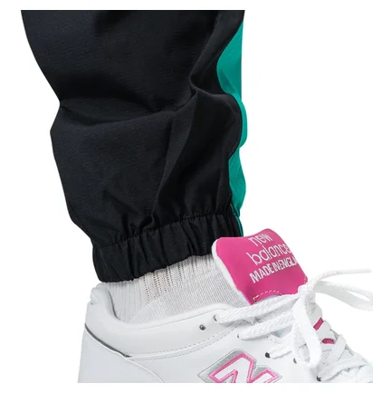New Balance MP91507 VDE NB Athletics Windbreaker Pant (Schwarz / Türkis)